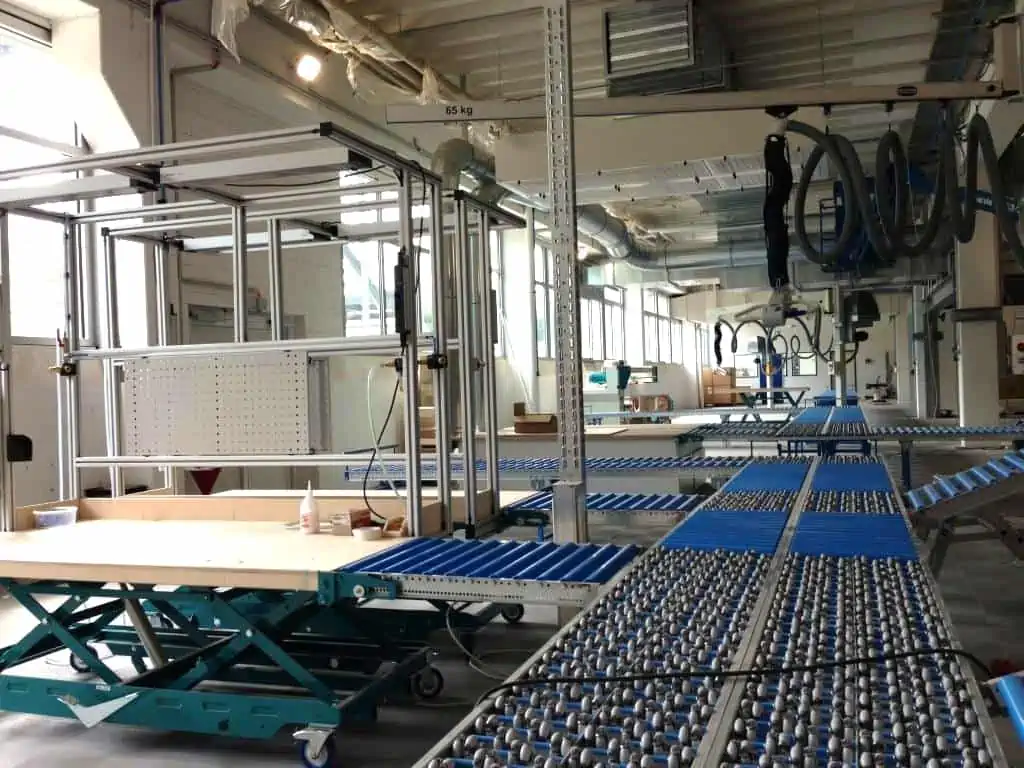 View into the production with roller conveyor system at d&b Audiotechnik