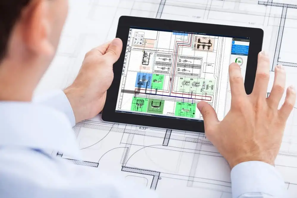 planner uses touch computer for factory layout planning